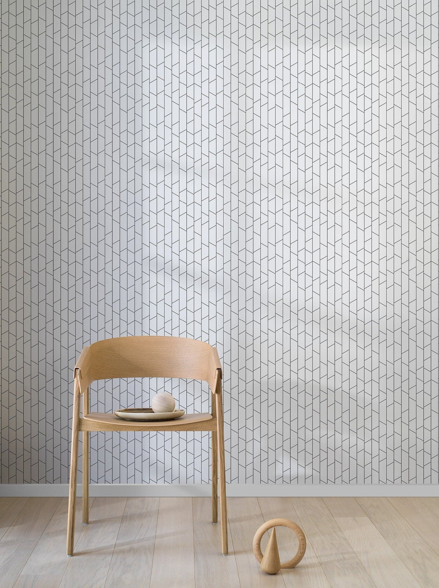 The bold simplicity of our Angle wallpaper in a black and white palette is inspired by the everyday lines seen around us, such as railings, facades, masts, and power lines.