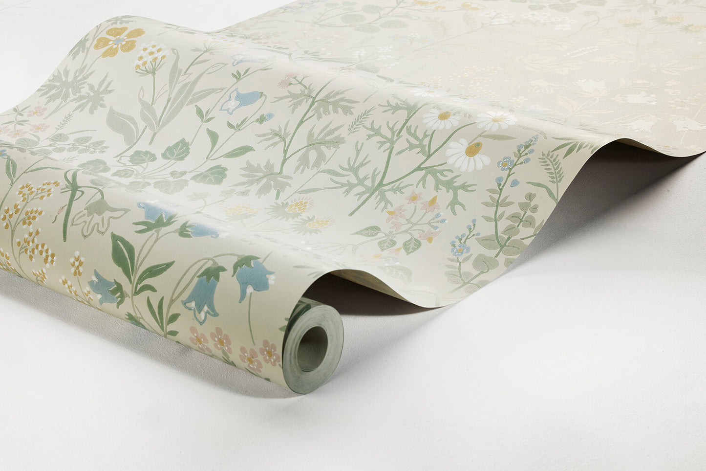 Colored in a pretty pastel palette of green, pink, yellow, white and blue, our Flora wallpaper celebrates the sublime sights and scents of a Swedish spring meadow.