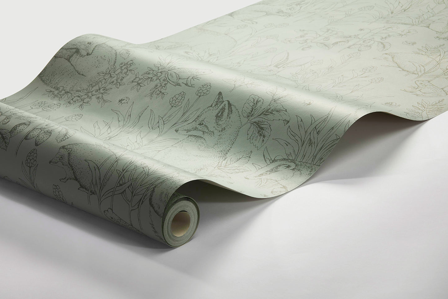 Colored in a gorgeous palette of contrasting greens, our Forest Friends wallpaper features a series of intricate illustrations.