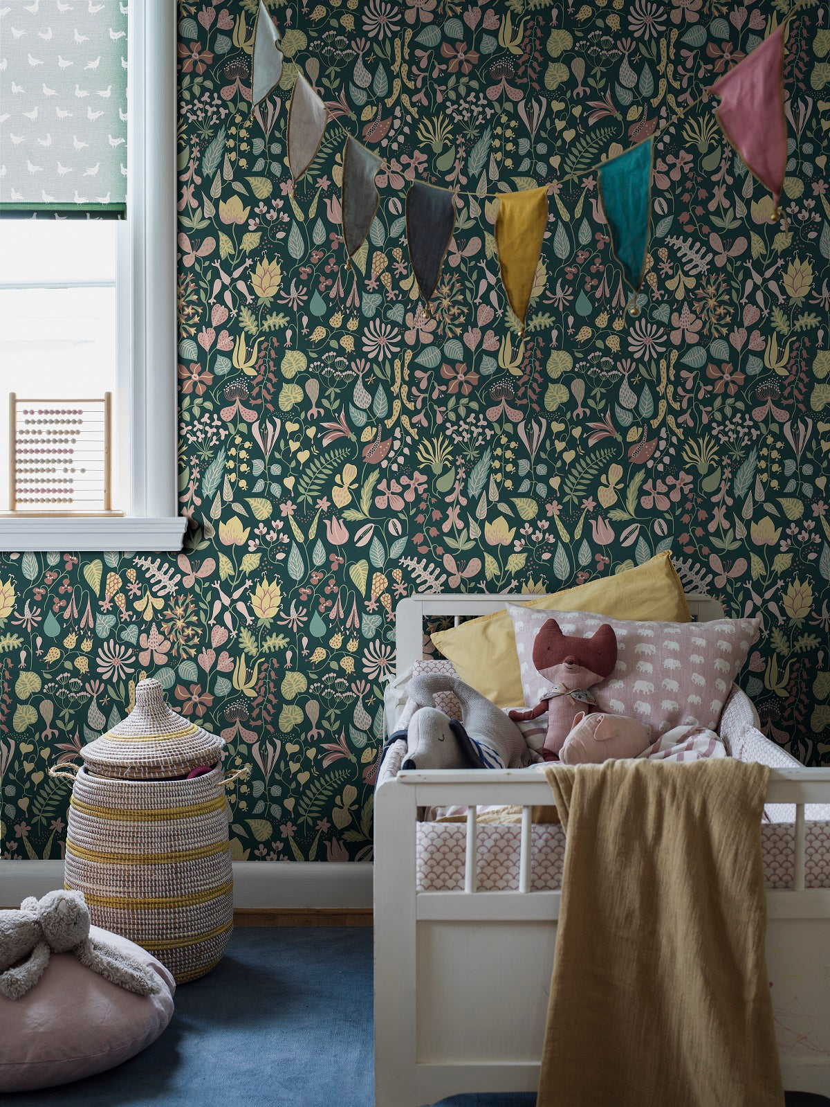 Featuring a beautiful softly multicolored floral design on a dark green background, our Herbarium wallpaper pays homage to the creative flair of the pattern’s designer, Stig Lindberg.