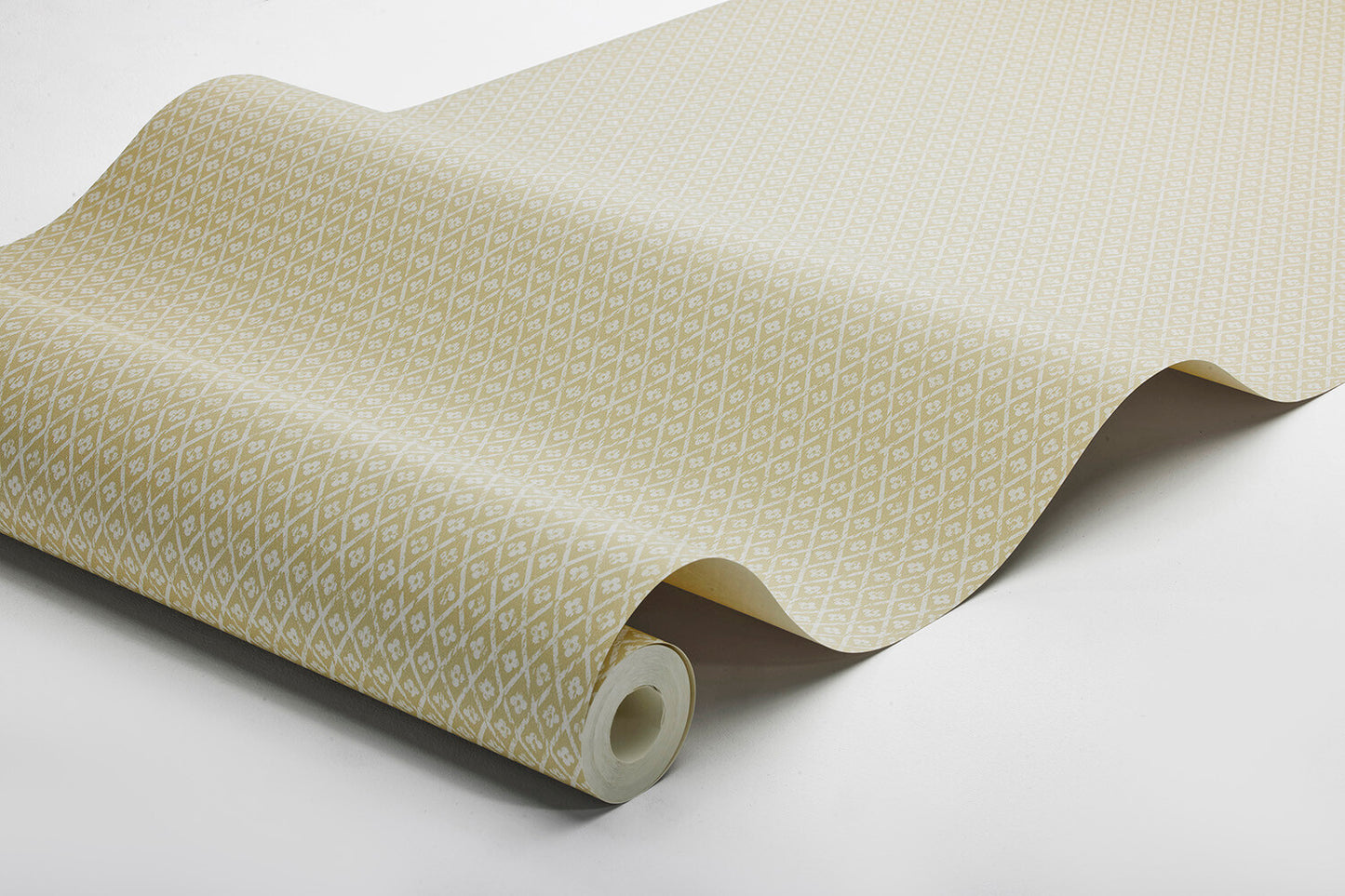Willowherb wallpaper is simple and rustic. Having the appearance of a single-color surface from a distance, its pretty petite design features a stylized four-petal flower within a diamond trellis pattern.
