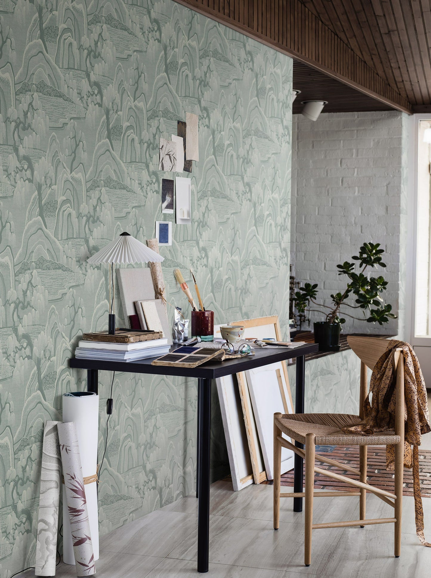 Featuring an intricate, hand-painted print from Noomi Spange, our Indigo Garden wallpaper in green creates a timelessly lovely interior for you to enjoy.