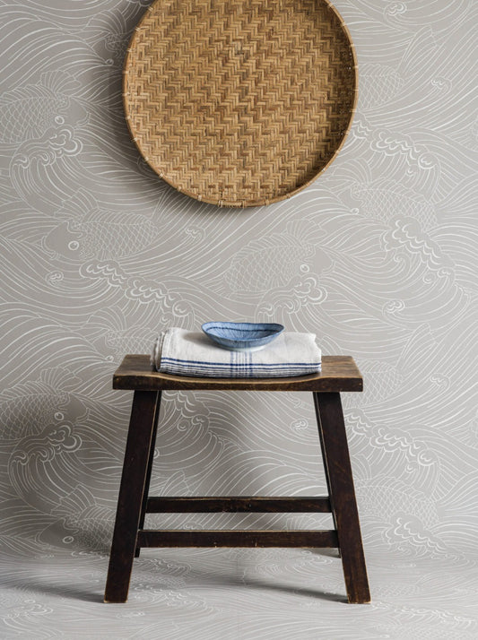 Wallpaper with inspiration from old woodcut techniques, Emma von Brömssen’s seemingly simple design Plenty more fish unveils an intriguing play with lines where fish hide in a wavy sea.