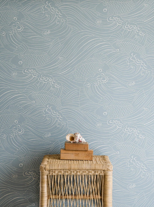 Wallpaper with inspiration from old woodcut techniques, Emma von Brömssen’s seemingly simple design Plenty more fish unveils an intriguing play with lines where fish hide in a wavy sea.