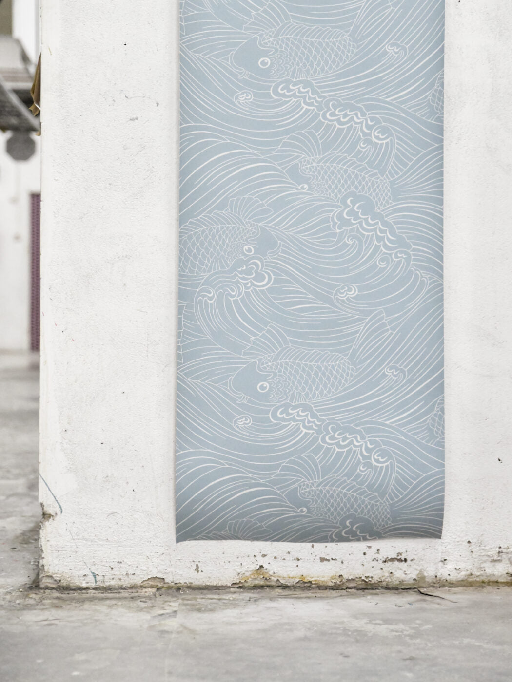 Wallpaper with inspiration from old woodcut techniques, Emma von Brömssen’s seemingly simple design Plenty more fish unveils an intriguing play with lines where fish hide in a wavy sea.