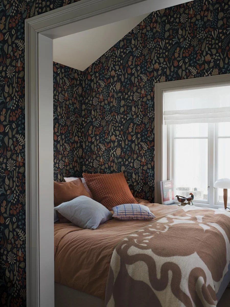This version of our Herbarium wallpaper has a darker, refined mood with its deep blue backdrop and detailing in tones of terracotta, muted blues, greens, and warm browns.