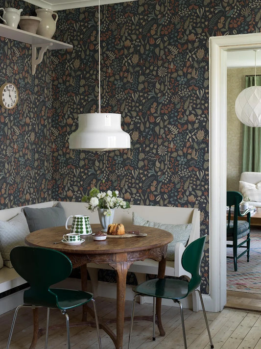 This version of our Herbarium wallpaper has a darker, refined mood with its deep blue backdrop and detailing in tones of terracotta, muted blues, greens, and warm browns.