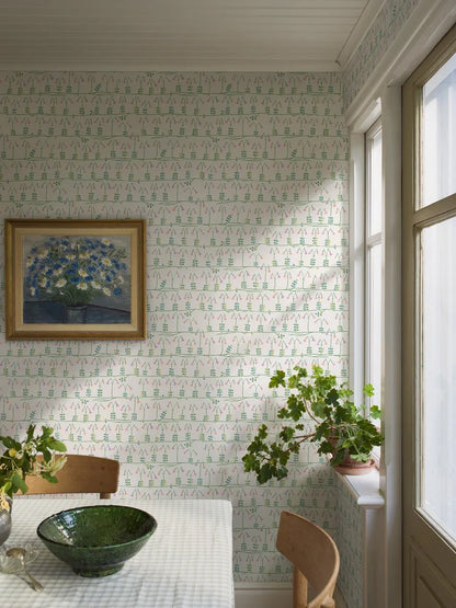 Our sublime Linnea wallpaper has delicate stylized florals in pink, green, and blue on a fresh white backdrop. Originally designed for porcelain in the 1960s by celebrated Scandinavian designer Stig Lindberg, we have retained all nine colors of the original palette thanks to a special printing technique.