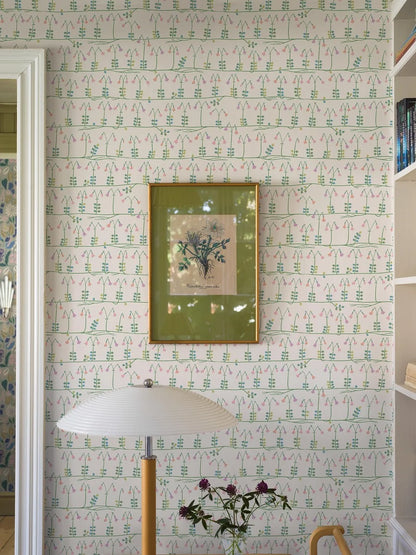 Our sublime Linnea wallpaper has delicate stylized florals in pink, green, and blue on a fresh white backdrop. Originally designed for porcelain in the 1960s by celebrated Scandinavian designer Stig Lindberg, we have retained all nine colors of the original palette thanks to a special printing technique.