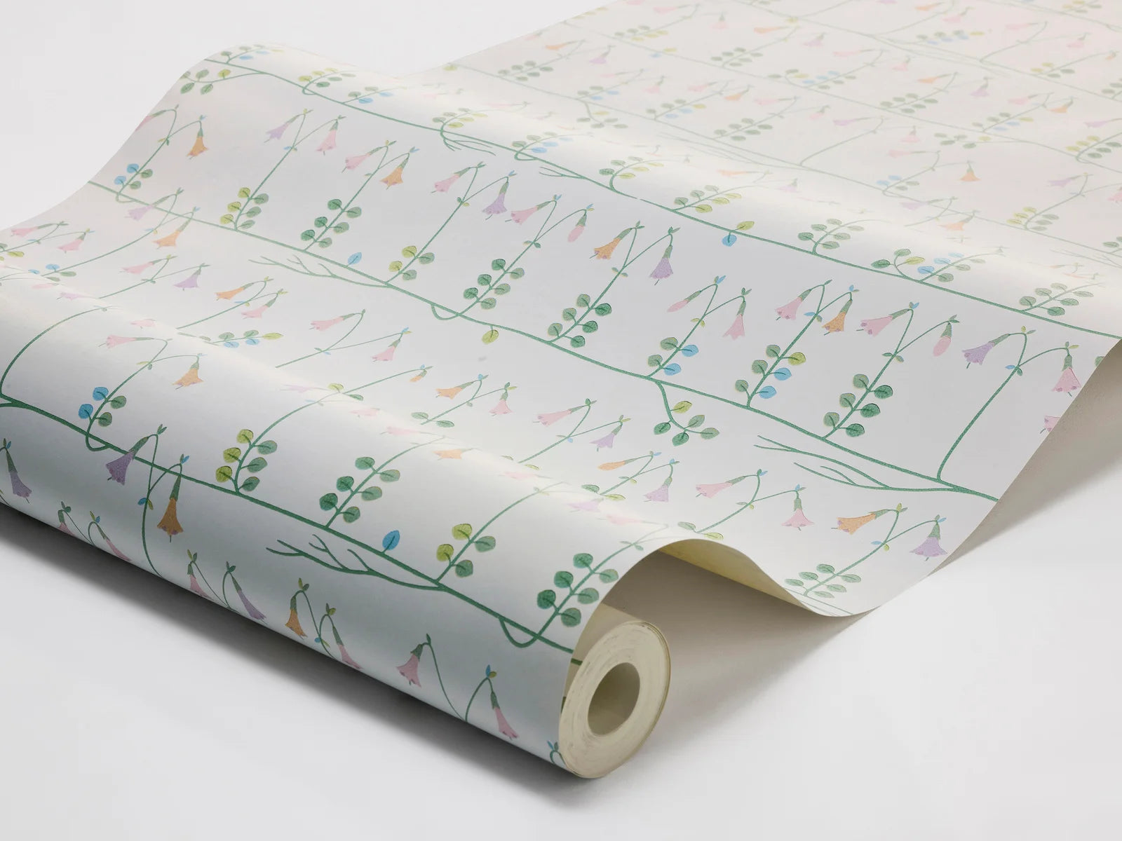 Our sublime Linnea wallpaper has delicate stylized florals in pink, green, and blue on a fresh white backdrop. Originally designed for porcelain in the 1960s by celebrated Scandinavian designer Stig Lindberg, we have retained all nine colors of the original palette thanks to a special printing technique.