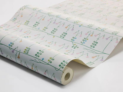 Our sublime Linnea wallpaper has delicate stylized florals in pink, green, and blue on a fresh white backdrop. Originally designed for porcelain in the 1960s by celebrated Scandinavian designer Stig Lindberg, we have retained all nine colors of the original palette thanks to a special printing technique.