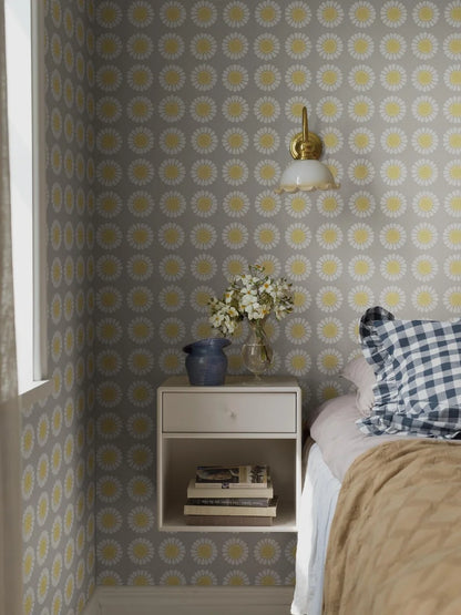 Soft, sunny, and full of charm, this colorway of our Daisy wallpaper reimagines Turi Gramstad Oliver’s 1969 design in gentle tones of grey and yellow. 