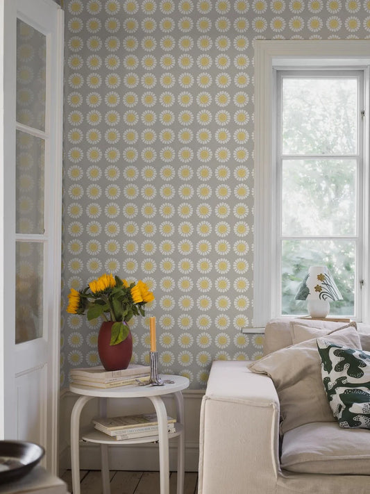Soft, sunny, and full of charm, this colorway of our Daisy wallpaper reimagines Turi Gramstad Oliver’s 1969 design in gentle tones of grey and yellow. 