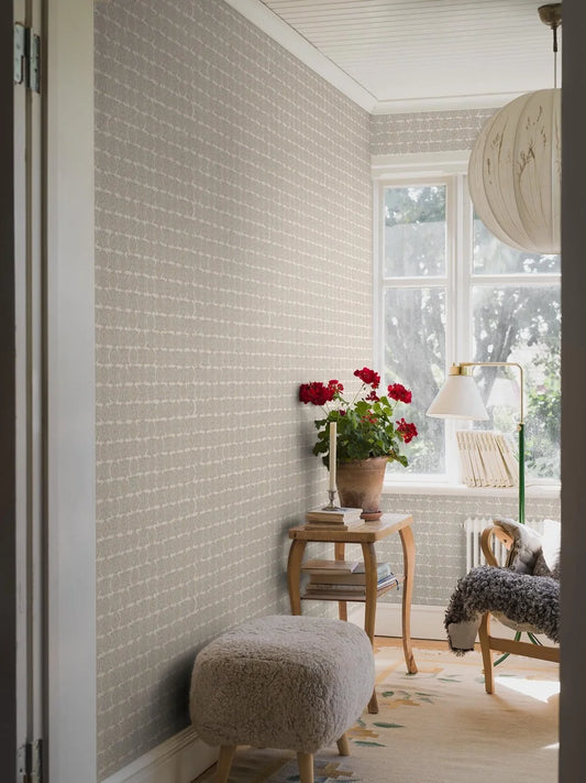  Soft and sophisticated, our Astrid wallpaper in subtle blue and beige tones creates a warm, textile effect that feels both natural and refined. 