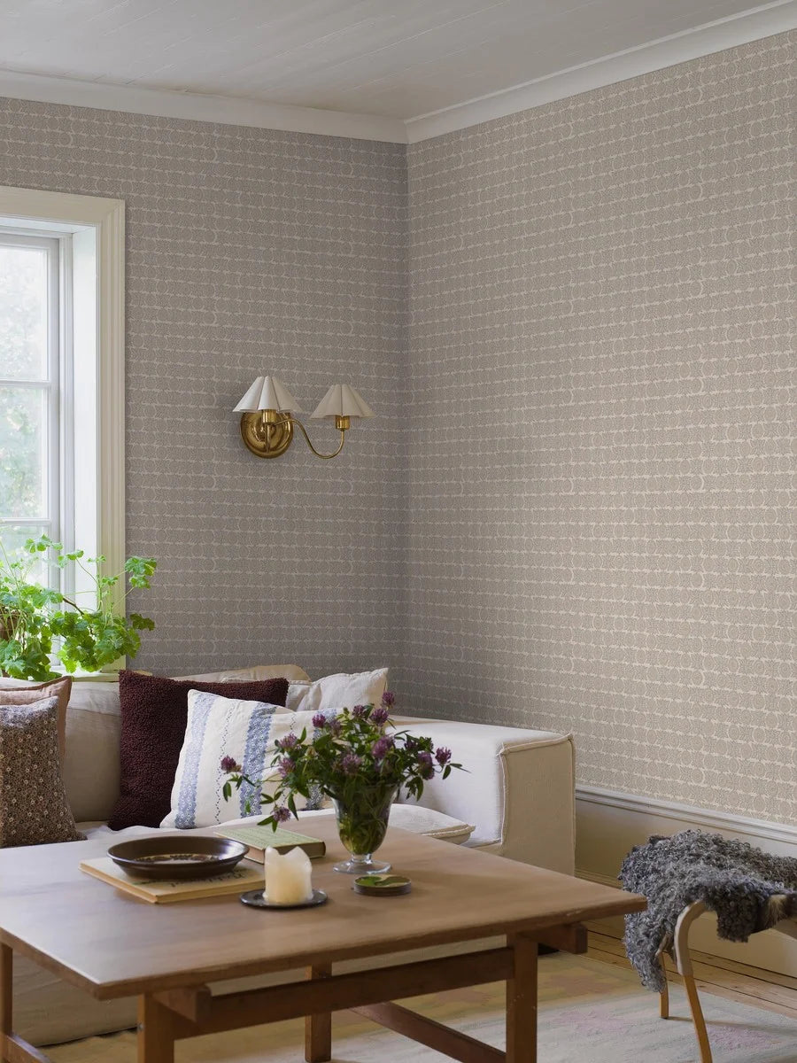  Soft and sophisticated, our Astrid wallpaper in subtle blue and beige tones creates a warm, textile effect that feels both natural and refined. 