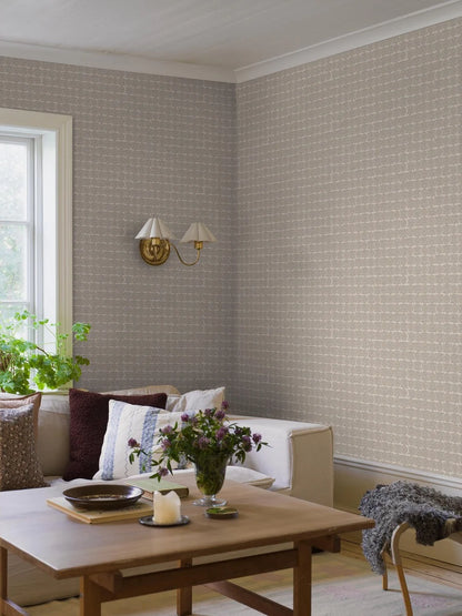  Soft and sophisticated, our Astrid wallpaper in subtle blue and beige tones creates a warm, textile effect that feels both natural and refined. 