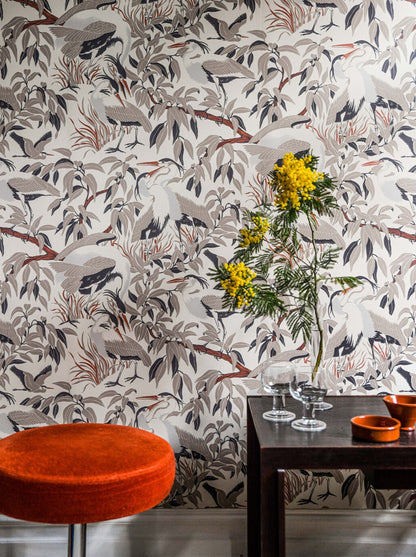 A rhythmic play with formations encouraging the eye to look for the hidden birds in the pattern of this wallpaper.