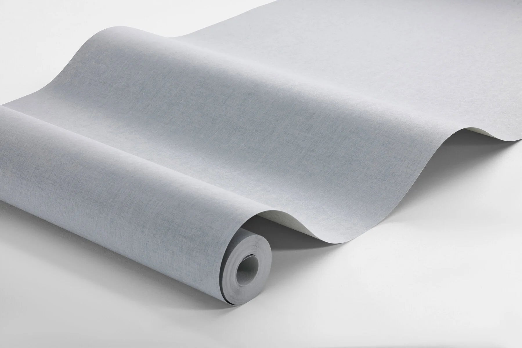 Bring a soothing character to your home with our Vega wallpaper in a muted light blue shade.