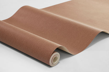 Deep Terra is a rich terracotta-colored wallpaper with a warm, earthy character. The wallpaper has a tactile linen texture that gives the color depth and a vibrant expression