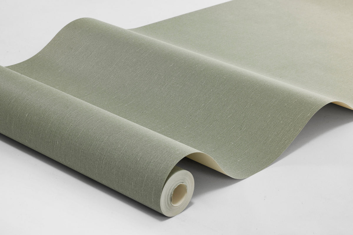  a muted, warm grey-green wallpaper inspired by the soft tones of sage leaves. The tactile linen texture gives the surface a lively expression and enhances the depth of the color. 