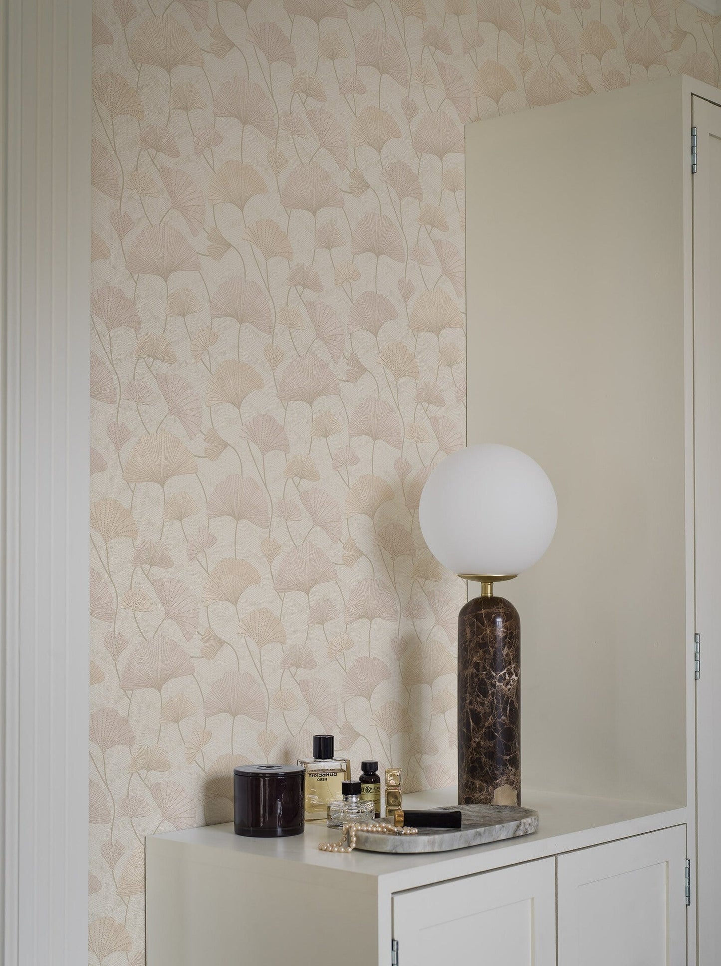 Colored in a luxurious and romantic palette of pink and apricot hues, our Sophia wallpaper is enhanced with hints of shimmering gold on a light background.