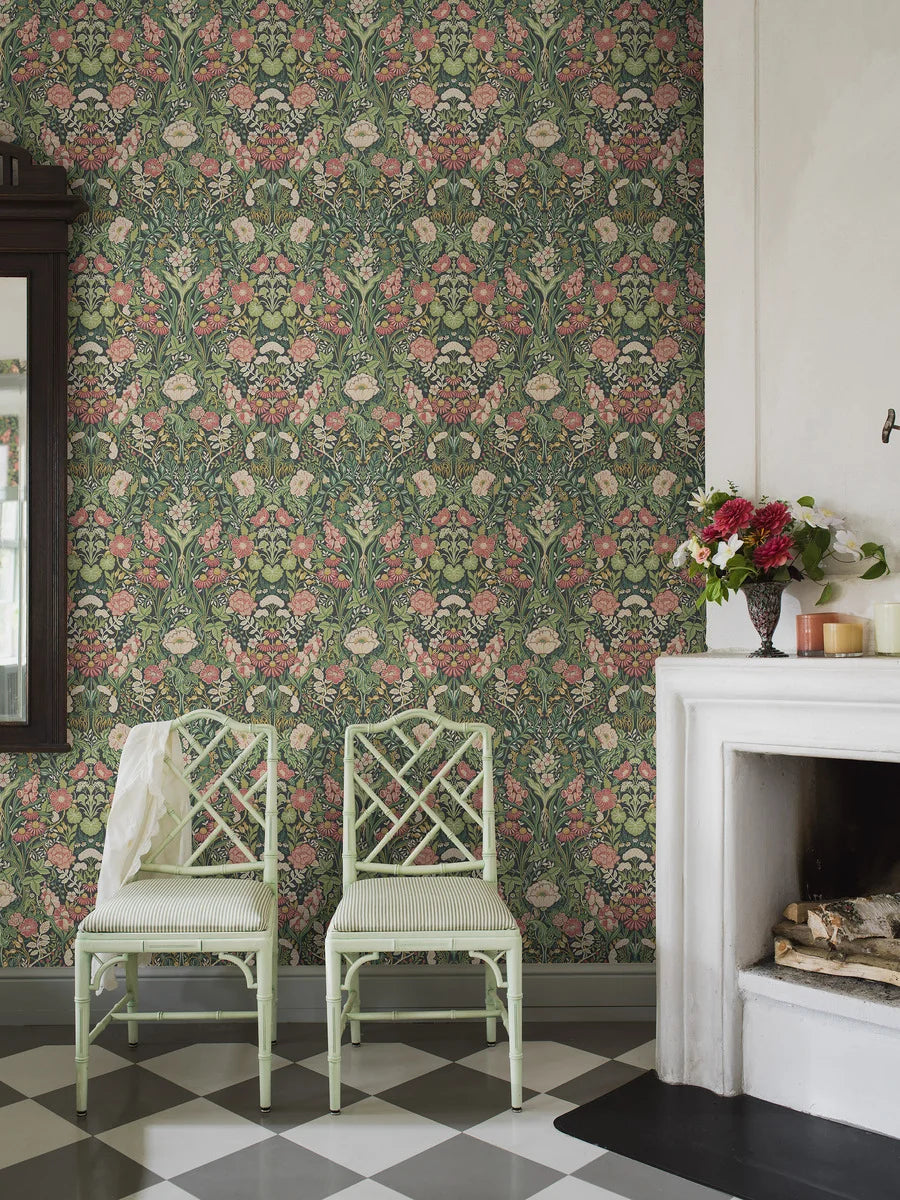 Experience the freshness and vibrancy of our Örtagård wallpaper in vivid and playful tones of muted light pink, green, and yellow on a striking black background. 