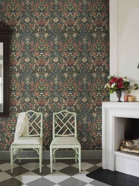 Immerse yourself in the traditional and classic charm of our Örtagård wallpaper in muted dark tones of burgundy, blue, olive green, yellow and cream on a bold black background.
