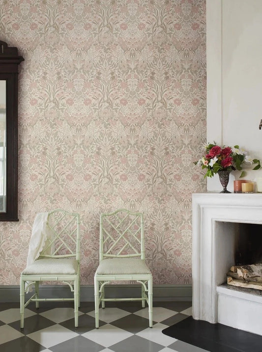Embrace the dreamy and romantic allure of our Örtagård wallpaper in a powdery pastel palette of pink, green, muted red and light beige. 