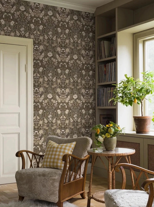 Colored in a neutral and contemporary palette of green, white, and beige set against a bold near black base, our Örtagård wallpaper is lush and vibrant. 