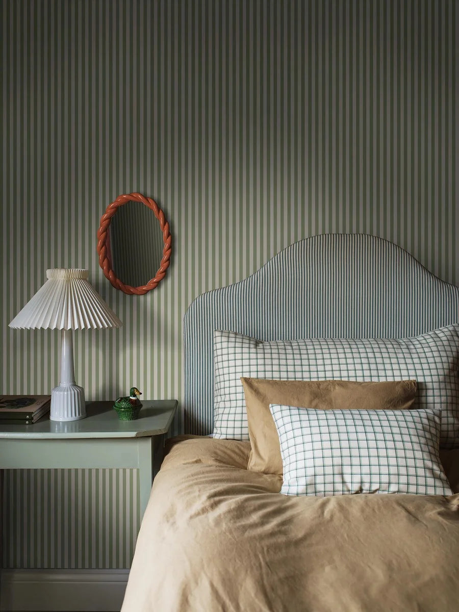 Mölle Stripe is a striped wallpaper inspired by the classic Swedish seaside town of Mölle in Skåne – known for its free-spirited bathing culture at the turn of the 20th century.