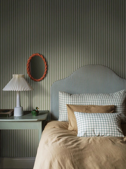 Mölle Stripe is a striped wallpaper inspired by the classic Swedish seaside town of Mölle in Skåne – known for its free-spirited bathing culture at the turn of the 20th century.