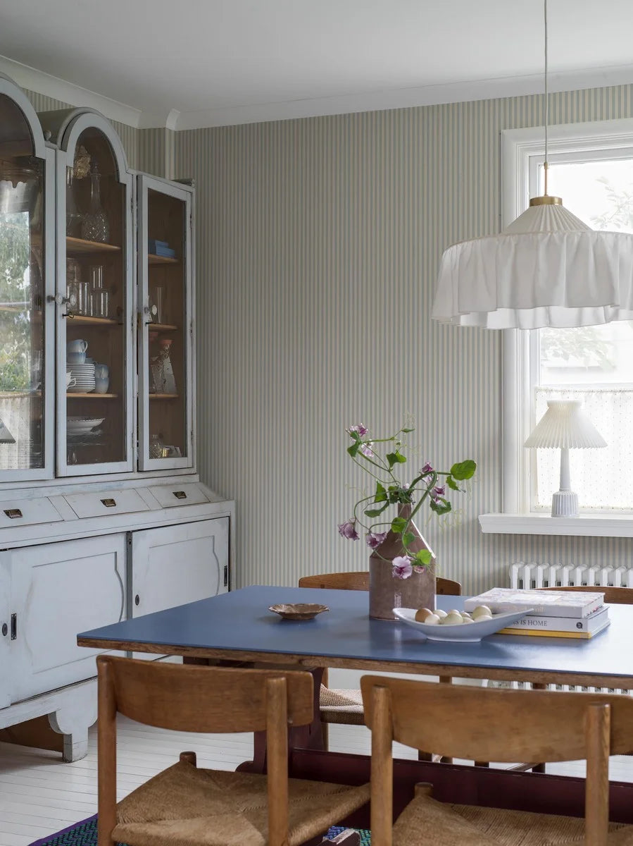 Mölle Stripe is a striped wallpaper inspired by the classic Swedish seaside town of Mölle in Skåne – known for its free-spirited bathing culture at the turn of the 20th century.