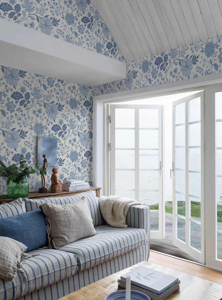 Our Alicia wallpaper features a creamy white base accented with an array of warm and cool blue shades.