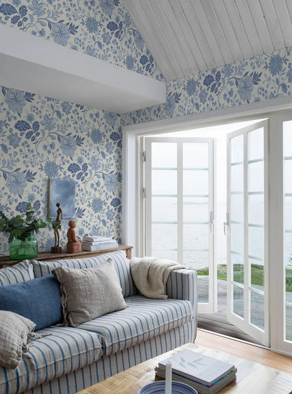 Our Alicia wallpaper features a creamy white base accented with an array of warm and cool blue shades.