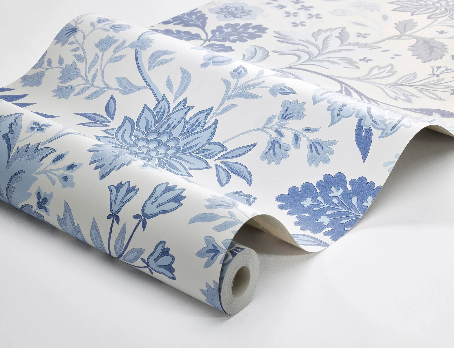 Our Alicia wallpaper features a creamy white base accented with an array of warm and cool blue shades.