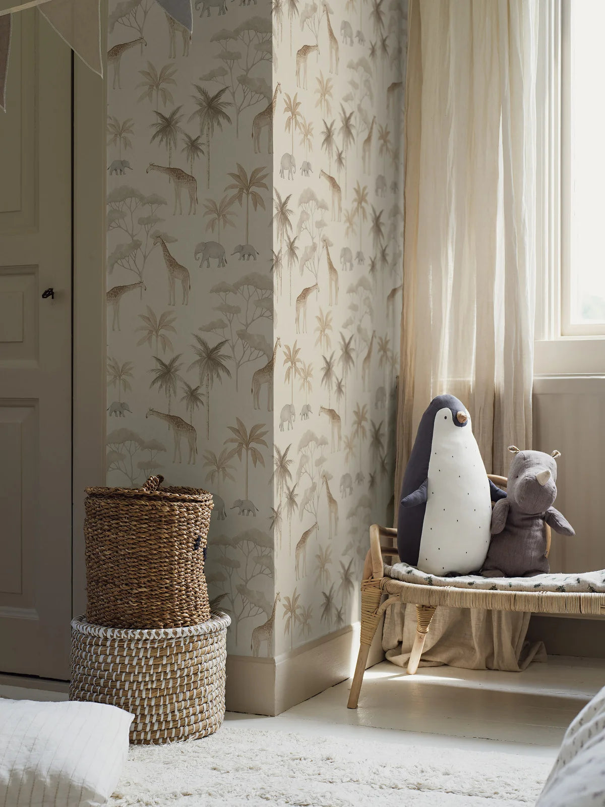 Our Savannah children’s wallpaper in natural tones of light linen, soft grey and golden beige on a sand-colored background