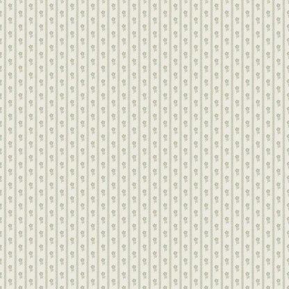  Lilla Lyckan wallpaper in powdery light green introduces a calming and fresh touch, with petite, hand-drawn flowers repeating on a cream background. 