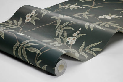 Our Floral Tree wallpaper pairs green leaves and white flowers with a charcoal black background, to create a bold, sophisticated design.