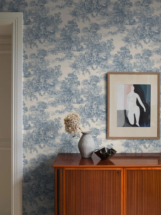 Bringing its rich blue imagery to life on a light clay-colored background, our Toile de Jouy wallpaper is classic and continental.