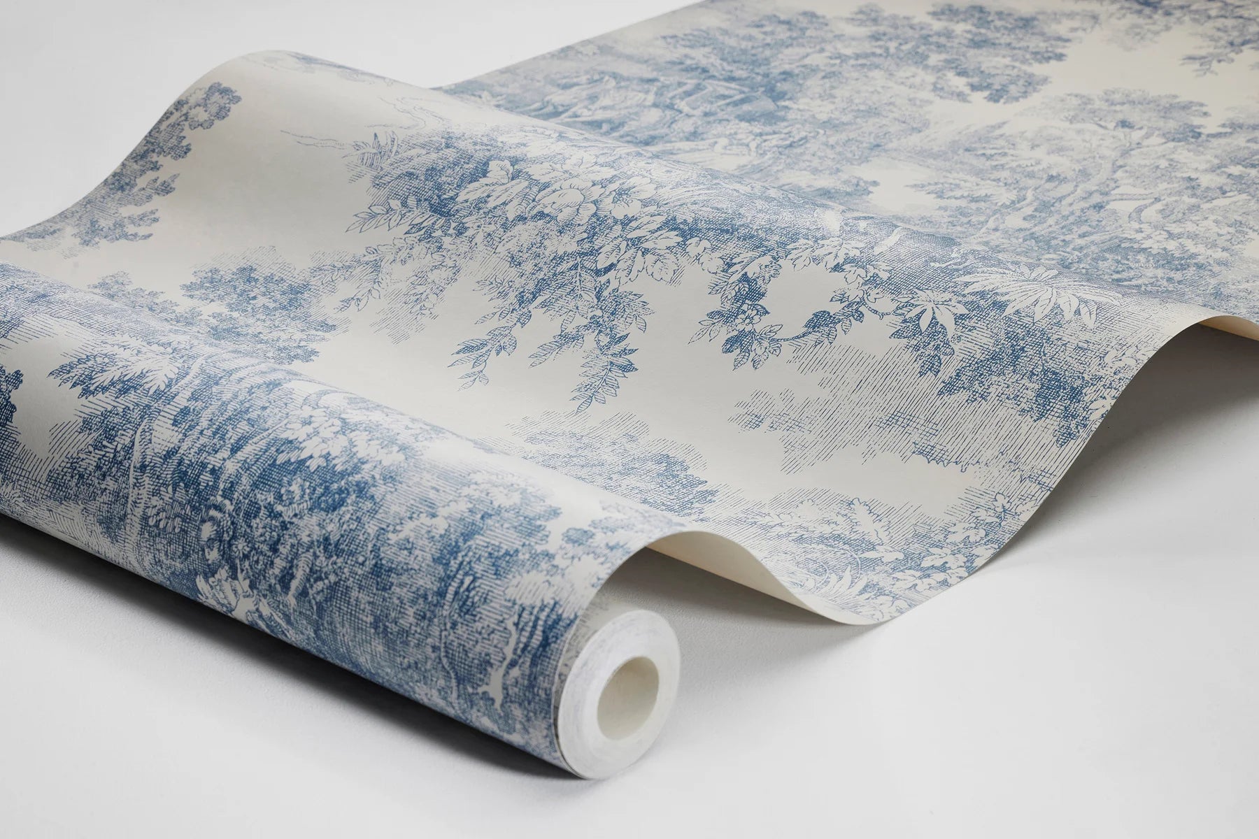 Bringing its rich blue imagery to life on a light clay-colored background, our Toile de Jouy wallpaper is classic and continental.