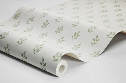 Our Little Oak wallpaper in fresh green on a creamy white base brings a lively yet soothing touch to your walls.