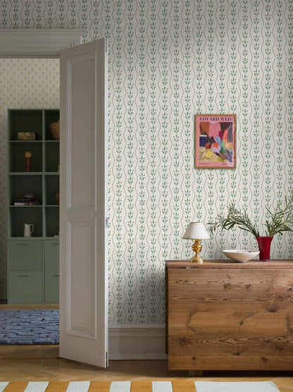 Colored in fresh leafy green tones punctuated with soft red detailing on a pure white background, our Flower Buds wallpaper brings a light, lively energy to your walls. 