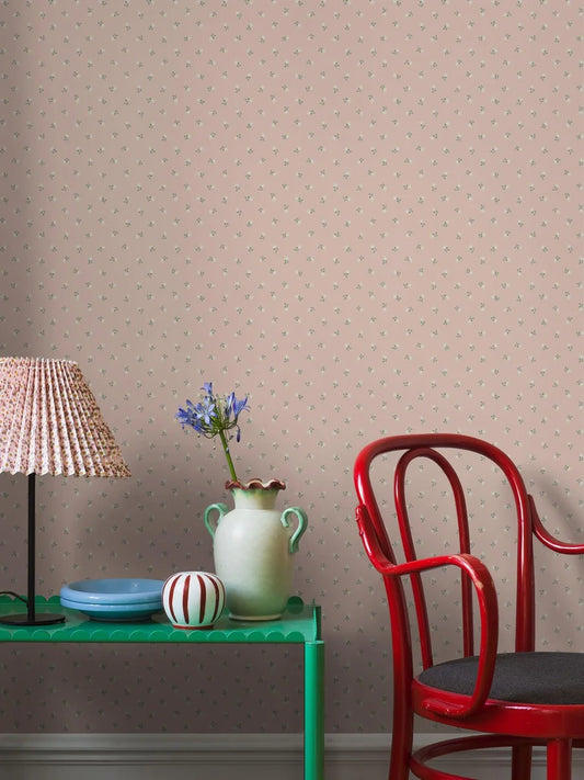 Colored in a pink palette with green and white detailing, our Petite Chérie wallpaper blends timeless expression with playful charm.