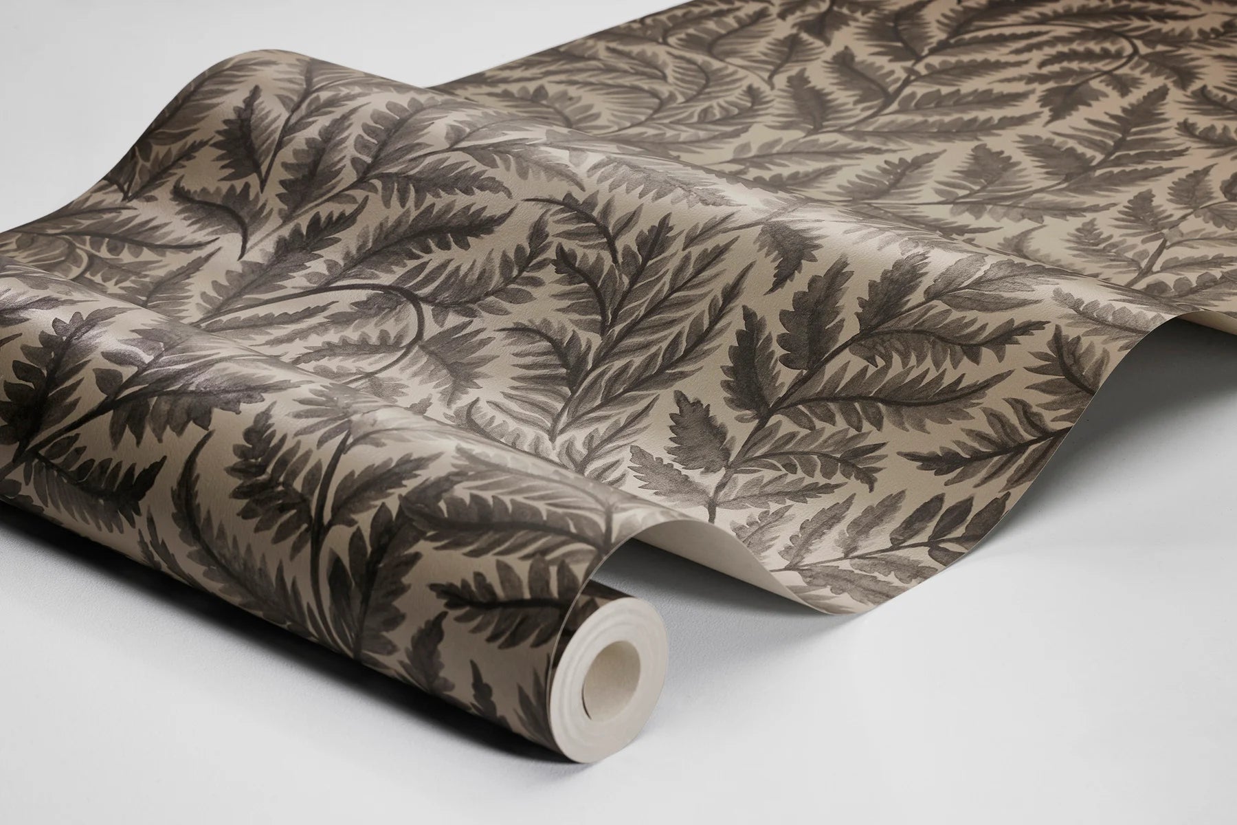 Featuring charcoal black leaves on a cool brown base, our Ferns wallpaper is bold yet understated. 