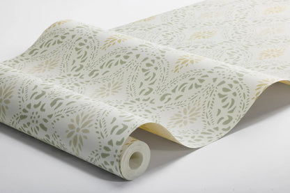 Colored in a bright yet cosy color scheme, our Kvarnholmen wallpaper features a stencil design, printed in soft green and ochre over a warm white background, with accents of sand-toned beige.