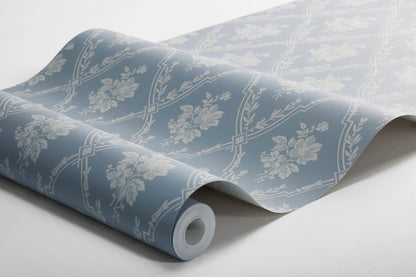  Colored in a warm light blue on a natural background, our Västigårn wallpaper echoes its rural Swedish roots. 