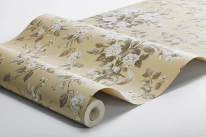 Colored in a muted yellow with beige and grey-brown detailing, our Tullgarn wallpaper brings graceful and royal elegance to your space.