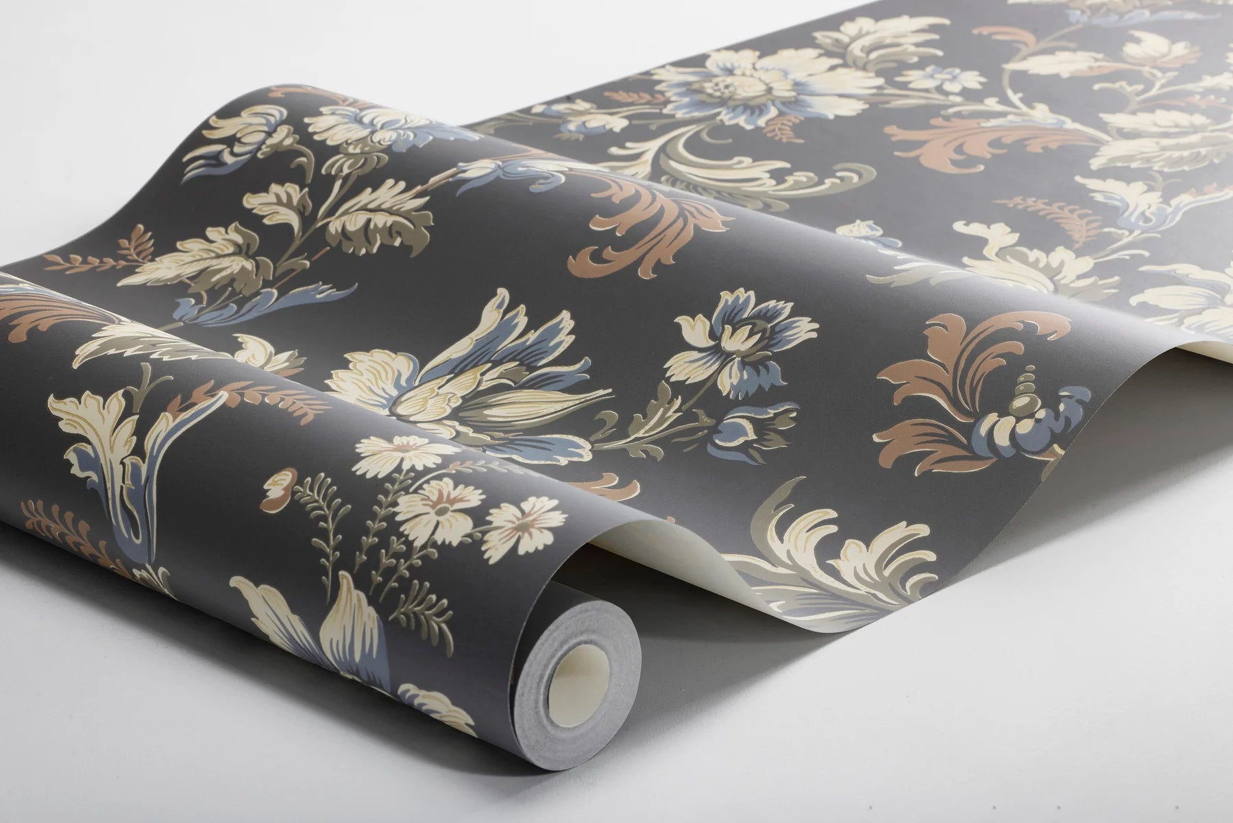 Set on a bold black background, with floral strands in tones of olive green, brown and blue, our Elvira wallpaper shimmers with golden detail.