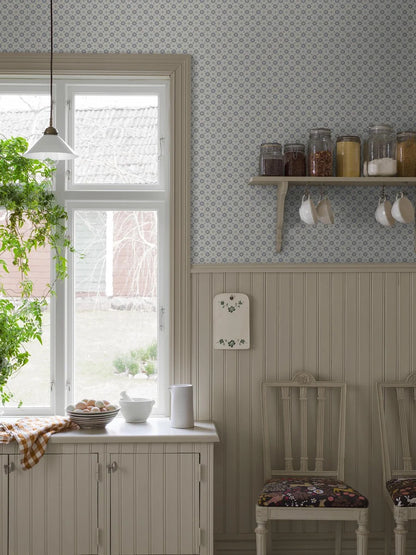  Set on a natural background with muted blue detailing, our Stella wallpaper balances structure and whimsy perfectly. 