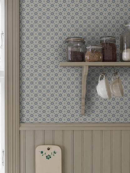  Set on a natural background with muted blue detailing, our Stella wallpaper balances structure and whimsy perfectly. 